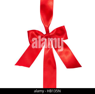 Red vertical gift ribbon and luxurious bow isolated on white background Stock Photo