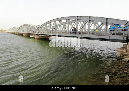 The July 14, 1897 opened Faidherbe metallic bridge spans the Senegal river linking the island-city of St.-Louis with the African mainland Stock Photo