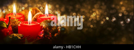 Advent candles with christmas decoration . Stock Photo
