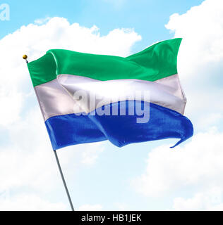 Flag of Sierra Leone waving in the wind, isolated white background ...