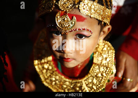 Bhaktapur, Nepal. 4th Dec, 2016. A Nepalese Newar girl looks on during Bel Bibaha or Ehee rituals in Bhaktapur, Nepal on Sunday, December 4, 2016. Pre adolescent girls from Newar community get married thrice, the first to the Bel or holy fruit, second is the marriage with the Sun and the third a real husband. Performing these rituals to ward evil spirits, but mainly to protect her from widowhood holds the ritual ceremony. Credit:  Skanda Gautam/ZUMA Wire/Alamy Live News Stock Photo