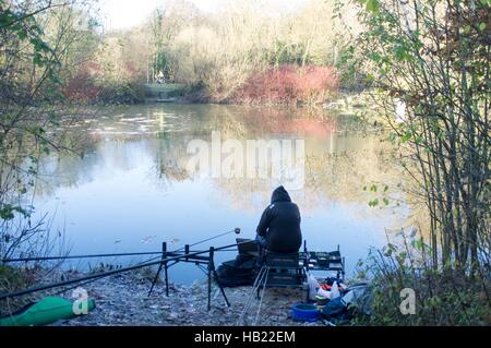 Bracknell, UK. 4th December, 2016. Firshermen taking part in a competition on a frozen lake at Westmorland Park, Bracknell Credit:  Andrew Spiers/Alamy Live News Stock Photo