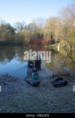 Bracknell, UK. 4th December, 2016. Firshermen taking part in a competition on a frozen lake at Westmorland Park, Bracknell Credit:  Andrew Spiers/Alamy Live News Stock Photo