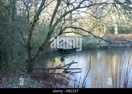 Bracknell, UK. 4th December, 2016. Firshermen taking part in a competition on a frozen lake at Westmorland Park, Bracknell Credit:  Andrew Spiers/Alamy Live News Stock Photo