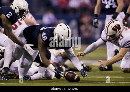 Indianapolis, Indiana, USA. 3rd Dec, 2016. December 3, 2016 - Indianapolis, Indiana - Penn State Nittany Lions linebacker Manny Bowen (43) strips the ball from Wisconsin Badgers fullback Alec Ingold (45) in the first half during the Big Ten Championship game between Penn State Nittany Lions and Wisconsin Badgers at Lucas Oil Stadium. © Scott Taetsch/ZUMA Wire/Alamy Live News Stock Photo