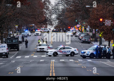 Washington, District of Columbia, USA. 4th Dec, 2016. D.C. Police block the streets after a North Carolina man walked into the Comet Ping Pong pizza restaurant in Northwest D.C. carrying an assault rifle and fired one or more shots, prompting patrons and employees to flee. The incident caused panic, with several businesses going into lockdown as police swarmed the neighborhood. A lone suspect in his late-20s was later arrested. Credit:  Ken Cedeno/ZUMA Wire/Alamy Live News Stock Photo