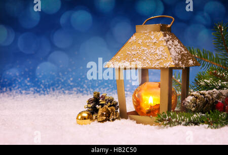 Christmas lantern on white snow. Stock Photo