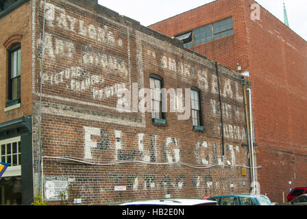 Old painted signs on the side of commercial buildings in central Indiana. Stock Photo