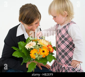 Mother and daughter with a bouquet of flowers Stock Photo