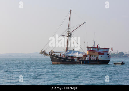CARTAGENA, COLOMBIA, JANUARY 8: Big passenger sailboat anchored in the bay of Cartagena with clear sky and tourists on board. Colombia 2015 Stock Photo