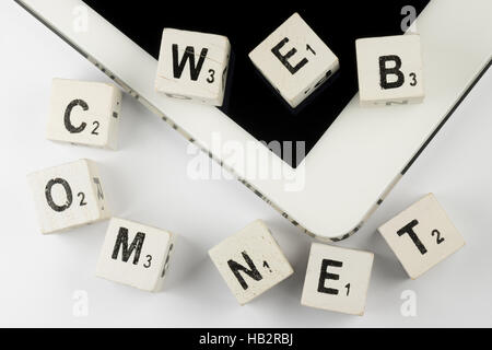 Tablet with old wooden letters Stock Photo