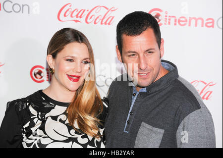 Female Star of the Year award winner Drew Barrymore (L) and Male Star of the Year award winner Adam Sandler attend The CinemaCon Big Screen Achievement Awards brought to you by The Coca-Cola Company during CinemaCon, the official convention of the National Association of Theatre Owners, at The Colosseum at Caesars Palace on March 27, 2014 in Las Vegas, Nevada. Stock Photo