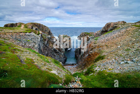 Huge rock and boulder outcrops along Cape Bonavista coastline in Newfoundland, Canada. Stock Photo