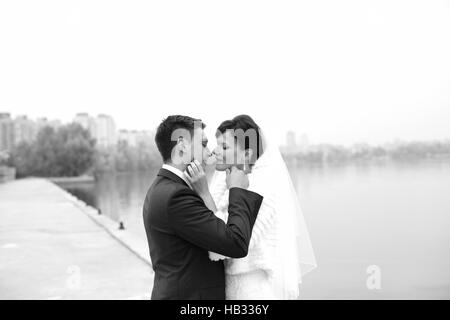 Gentle embrace bride and groom Stock Photo
