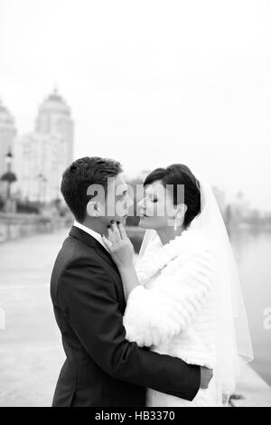 Gentle embrace bride and groom Stock Photo