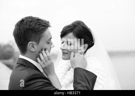 Gentle embrace bride and groom Stock Photo