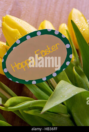 Happy  Easter card and tulips. Stock Photo