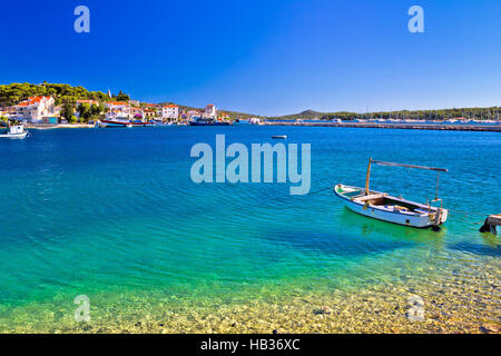 Boat on Turquoise beach in Rogoznica Stock Photo