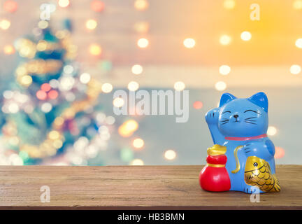 Greething Christmas the best of winter holiday. Wood plank with  sparkle blur bokeh for Christmas theme suitable for background Stock Photo