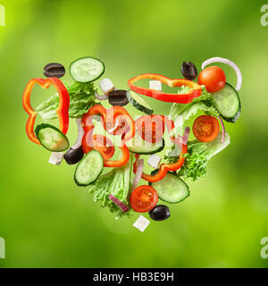 flying salad on natural green background Stock Photo