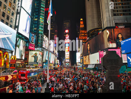 Times square with people in the night Stock Photo