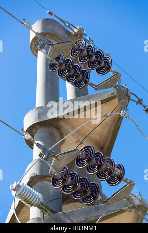 Concrete electrical line tower during sunny day, Uruguay Stock Photo