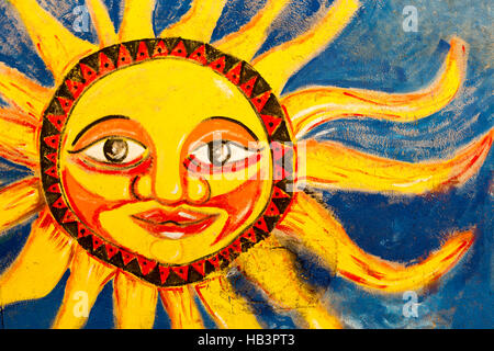 Colored bright sun mural painted on wall in Santa Marta, Colombia Stock Photo