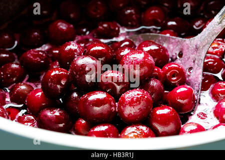 Red cherries in sugar syrup. Stock Photo