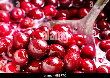 Red cherries in sugar syrup. Stock Photo