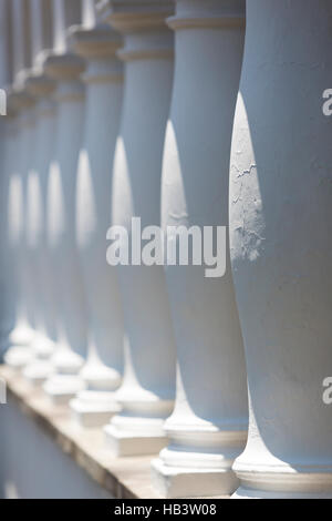 Colonial architectural details in Quito, white columns aligned in a row Stock Photo