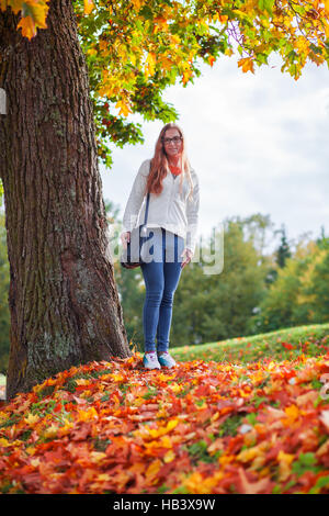 Beautiful woman in autumn park Stock Photo