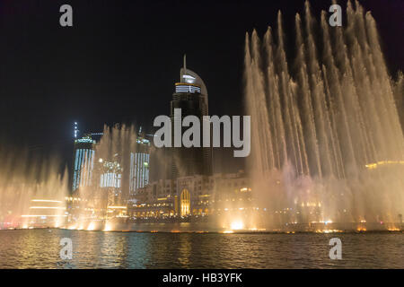 Fountains in action during night show in Dubai downtown Stock Photo