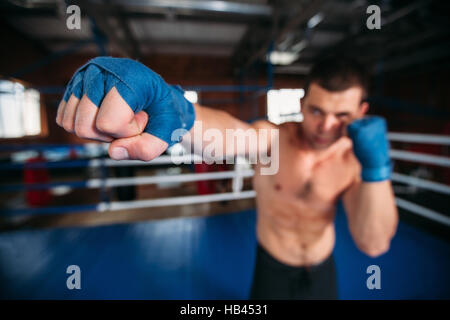 Boxer in blue wrist wraps on the training. Stock Photo