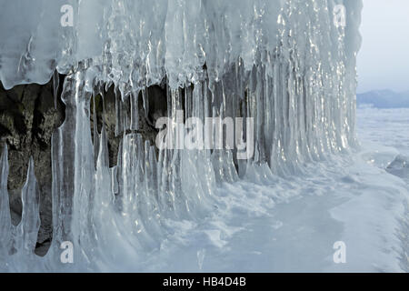 Huge icicles on rocks. Stock Photo