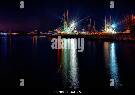 fishing boats in marina at night Stock Photo