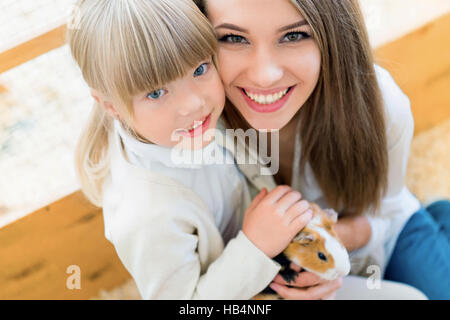 Family with cavy Stock Photo