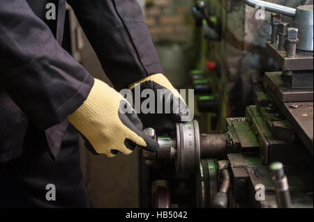 worker in protective gloves Stock Photo