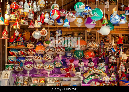 Wooden stall with decorations for winter holidays at traditional annual Christmas market in Old Town of Prague. Stock Photo