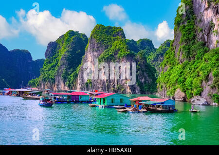 Floating fishing village rock island in Halong Bay Vietnam, Southeast Asia. UNESCO World Heritage Site. Cruise to Ha Long Bay. Stock Photo