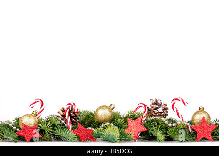 Christmas Border - tree branches with golden balls, candy and decoration Stock Photo