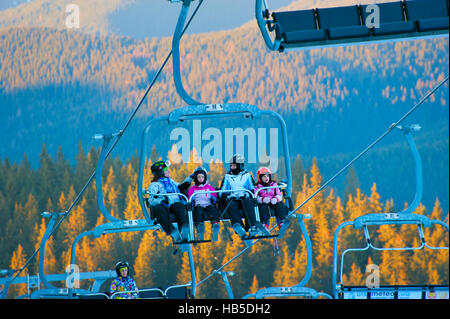 Women with children on a ski lift in Bukovel. Bukovel is the most popular ski resort in Ukraine. Stock Photo