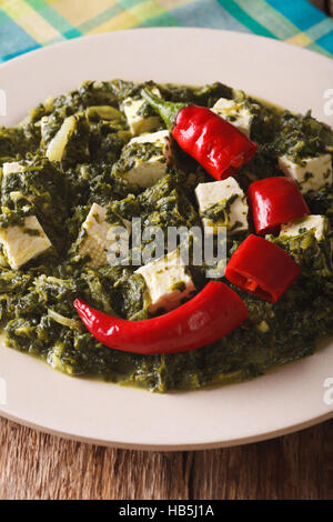 Indian cuisine: Palak paneer close-up on the table. vertical Stock Photo