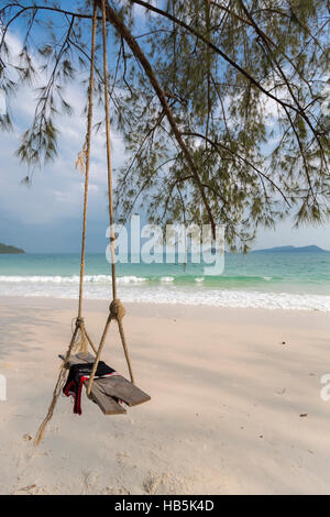 Empty old swing with view on the beach. Koh Rong Island in Cambodia Stock Photo