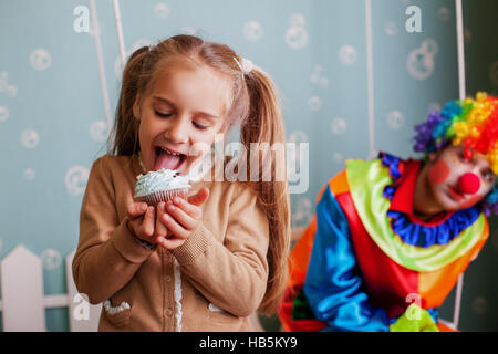 Girl eating birthday cake. Stock Photo