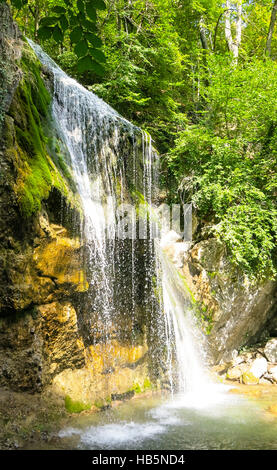 waterfall on a mountain river in the forest Stock Photo