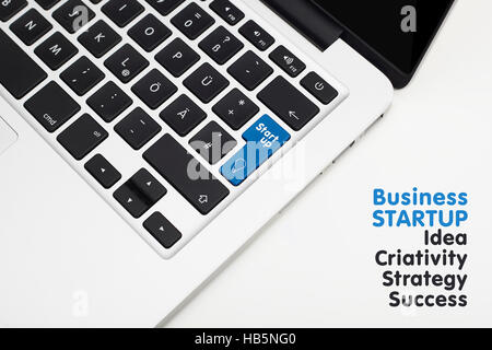 Laptop's keyboard with blue Start up key and copyspace Stock Photo