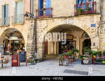 The arcades of Place du Marché in the old medieval town of Sommières, Gard, France Stock Photo