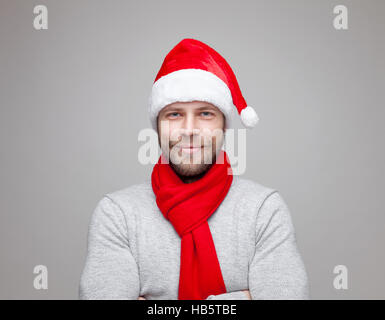 Portrait of a handsome man with beard wearing a Christmas hat Stock Photo