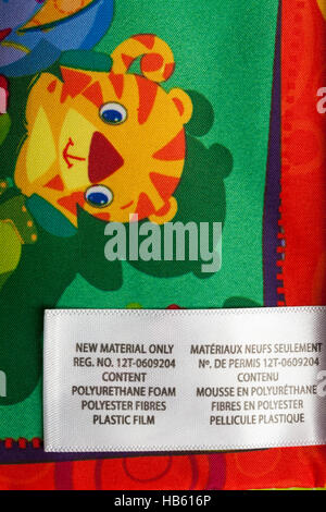 Label showing materials in Bright Starts in Teethe and Read fabric book for baby Stock Photo