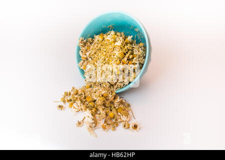 Bowl of dry chamomile Stock Photo